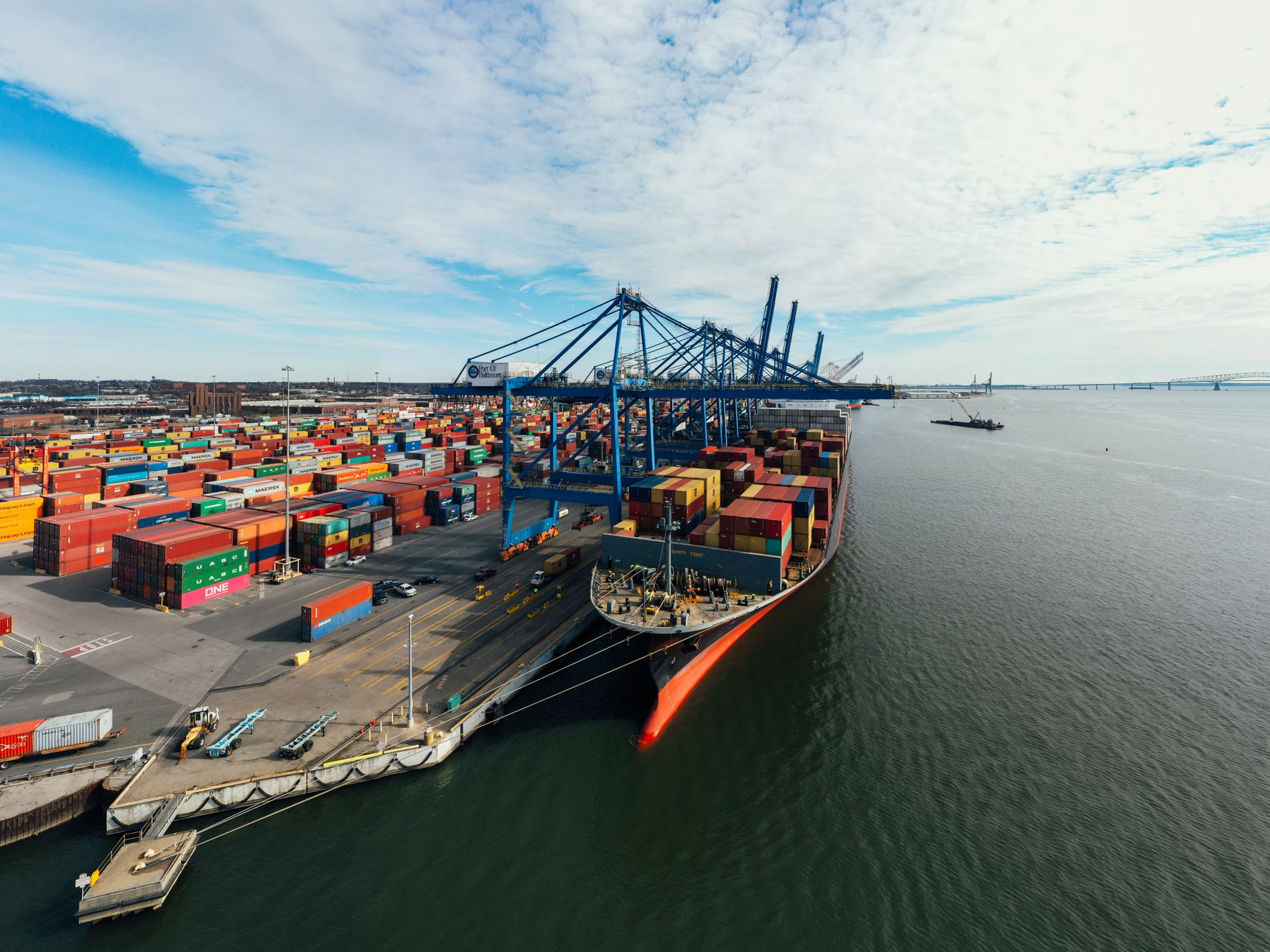 Container ship and cranes at a port terminal